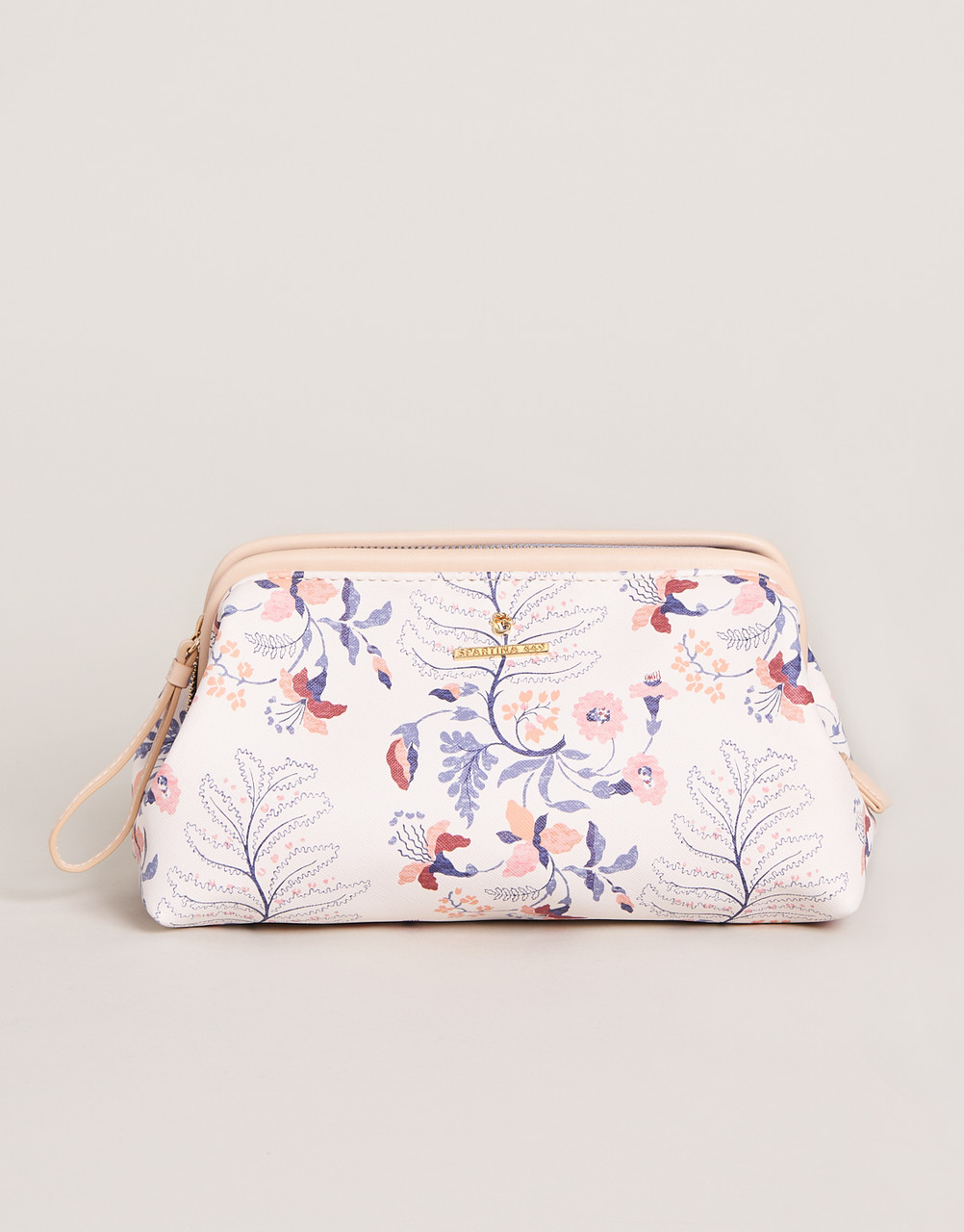  A small toiletry bag with a beautiful floral pattern in shades of pinks and blues